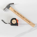 Orange tape measure + hammer